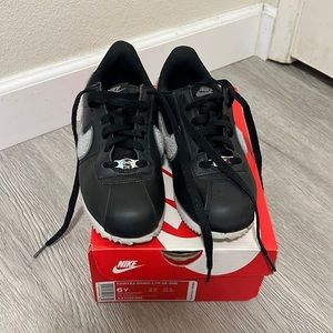 Nike Cortez black leather with fuzzy grey swoosh